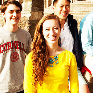 three students smiling